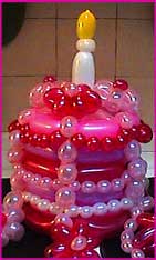 pink twisted balloon cake