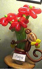 six red flower balloons monkey centerpiece bouquet